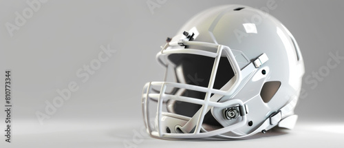 A clean white football helmet poised against a neutral background. photo