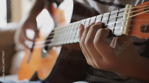 Close-up of a musician's hands skillfully playing an acoustic guitar. photo