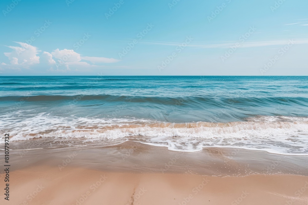 Fototapeta premium Serene ocean waves lapping on sandy beach