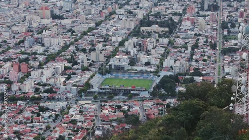 Aerial Push Past Mountain Top Antennas Over Salta Capital City Of Argentina And Football Stadium Estadio el Gigante del Norte. photo