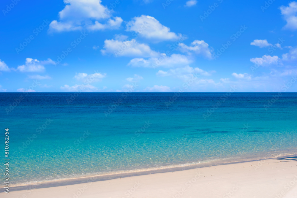 Nature of the beach and sea Summer with sunshine, sandy beaches, clear blue waters sparkling against the blue sky. On an island with good ecology and environment Background for summer vacation concept