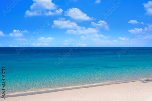 Nature of the beach and sea Summer with sunshine, sandy beaches, clear blue waters sparkling against the blue sky. On an island with good ecology and environment Background for summer vacation concept