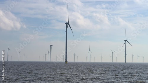 Windturbine field, panning shot,  in Lake IJssel of the Netherlands, Europe photo