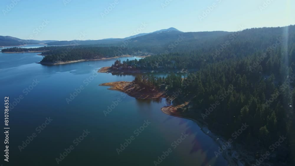 Sloping sandy shorelines drop into sparkling water of Big Bear Lake California Sloping sandy shorelines drop into sparkling water of Big Bear Lake California