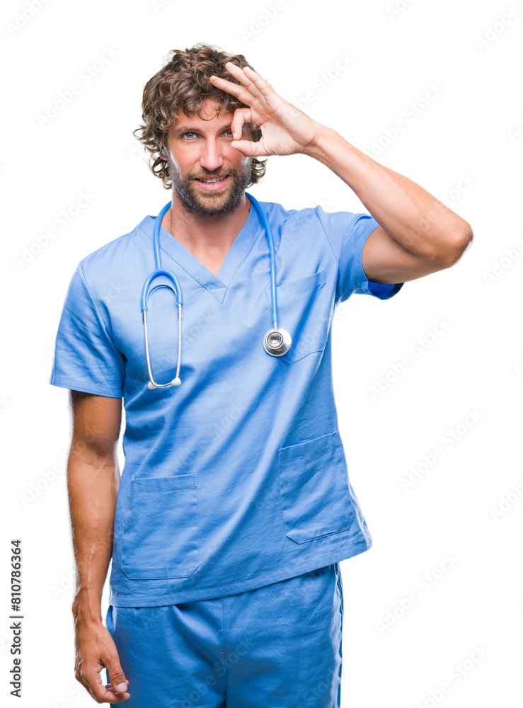 Handsome hispanic surgeon doctor man over isolated background doing ok gesture with hand smiling, eye looking through fingers with happy face. Handsome hispanic surgeon doctor man over isolated background doing ok gesture with hand smiling, eye looking through fingers with happy face.