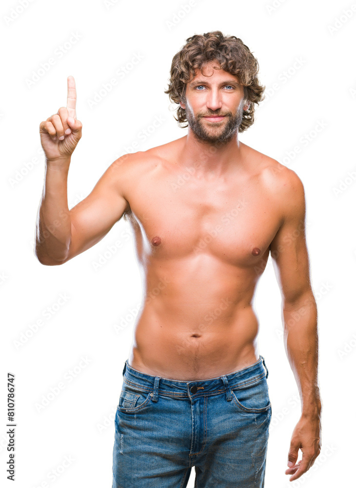 Fototapeta premium Handsome hispanic model man sexy and shirtless over isolated background showing and pointing up with finger number one while smiling confident and happy.