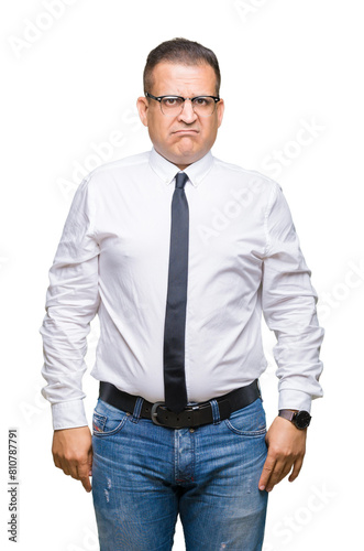 Middle age bussines arab man wearing glasses over isolated background depressed and worry for distress, crying angry and afraid. Sad expression.