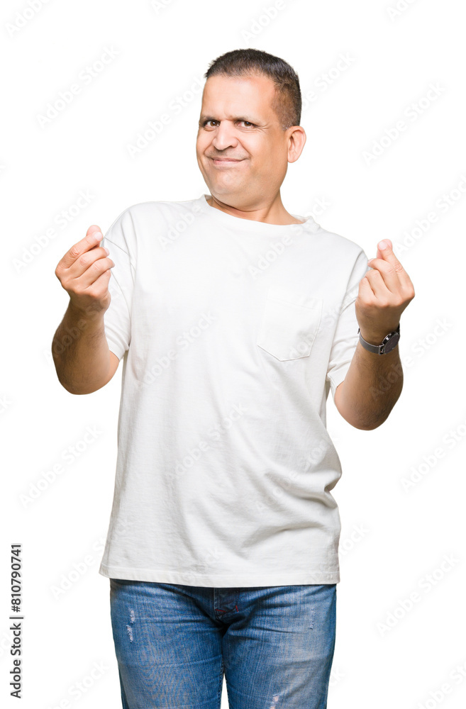 Middle age arab man wearig white t-shirt over isolated background Doing money gesture with hand, asking for salary payment, millionaire business Middle age arab man wearig white t-shirt over isolated background Doing money gesture with hand, asking for salary payment, millionaire business