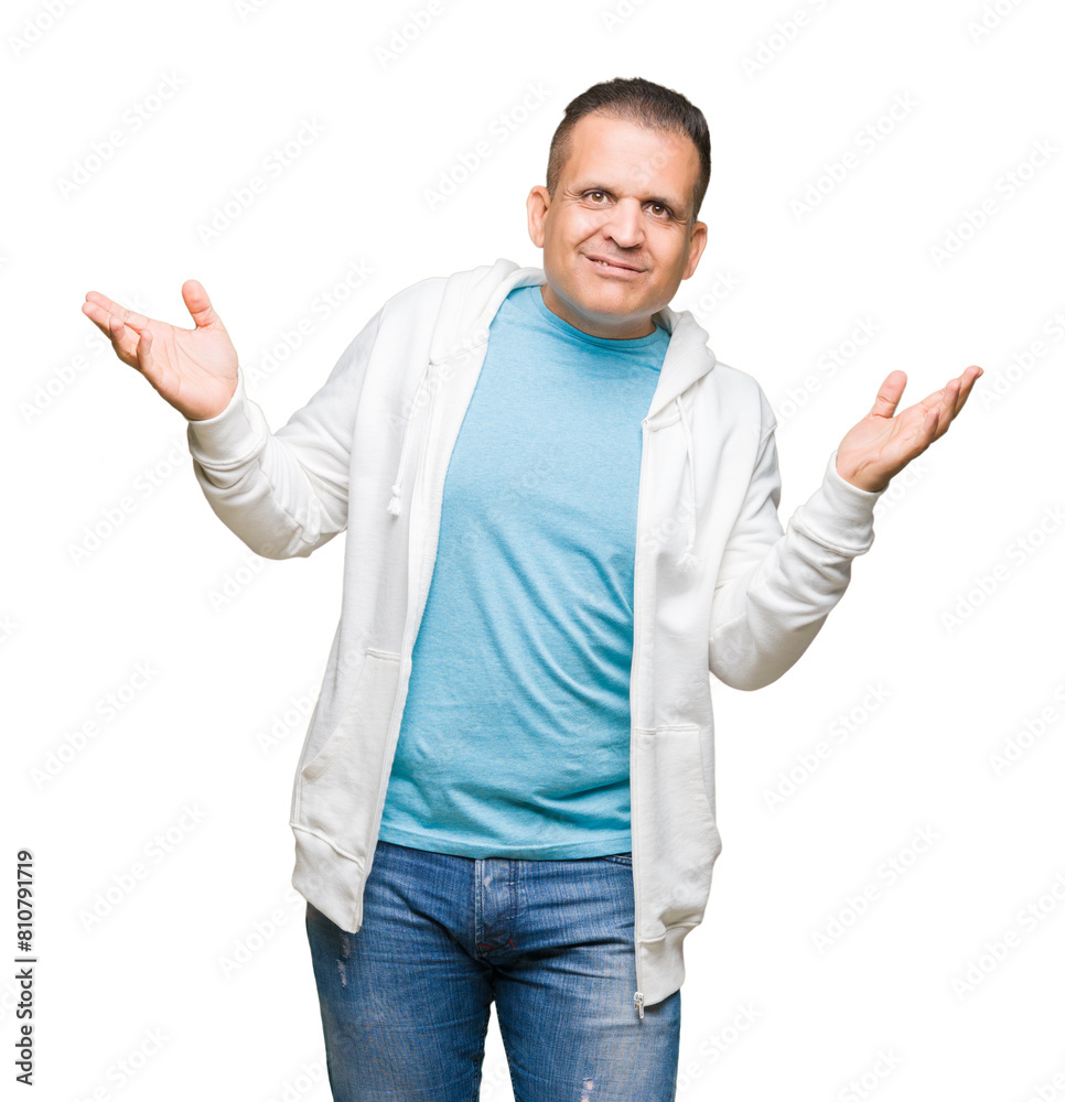 Middle age arab man wearing sweatshirt over isolated background clueless and confused expression with arms and hands raised. Doubt concept. Middle age arab man wearing sweatshirt over isolated background clueless and confused expression with arms and hands raised. Doubt concept.