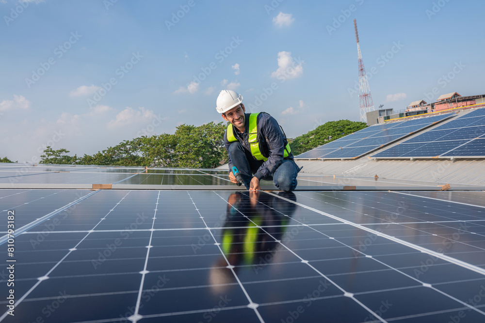 Service Engineer use tablet working inspection installation solar cell on the roof. Technician maintenance solar cells on roof factory. Technology solar energy renewable. Service Engineer use tablet working inspection installation solar cell on the roof. Technician maintenance solar cells on roof factory. Technology solar energy renewable.