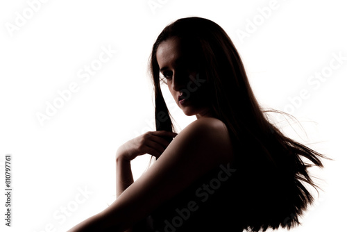 Half silhouette poirtrait of a beautiful girl with long hair isolated on white background. photo