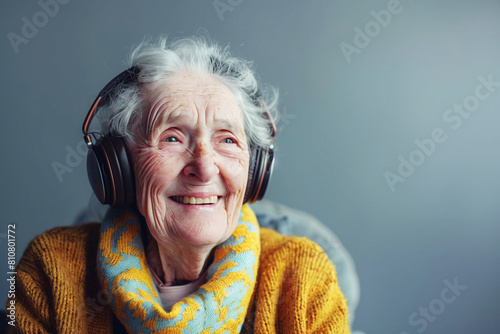 Elderly woman with headphones, copyspace