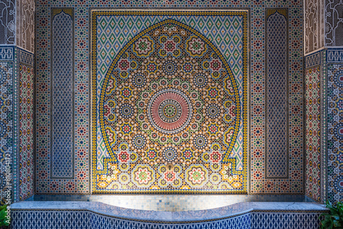 Intricate mosaic decoration in Marrakesh, Morroco.  Islamic patterns around an ancient water well