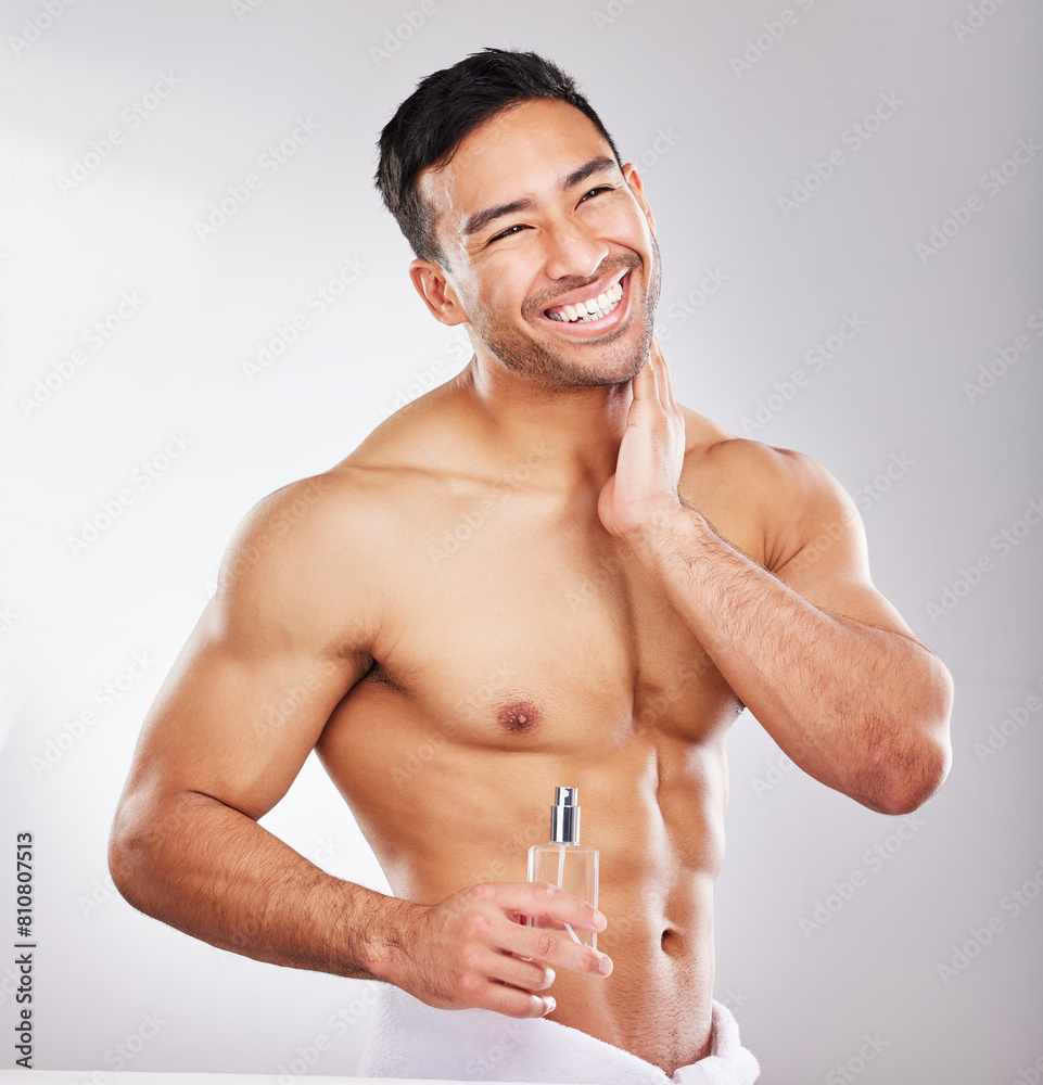 Happy, man and perfume in studio with skincare or grooming for self