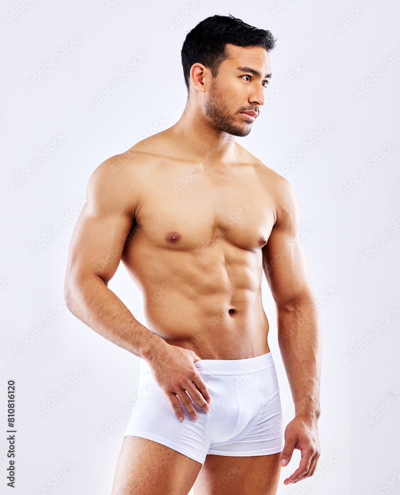 Thinking, fitness and man in underwear on studio, white background or bodybuilder mockup. Healthy, athlete and body of model with abs or muscle from exercise, workout or progress at gym with goals