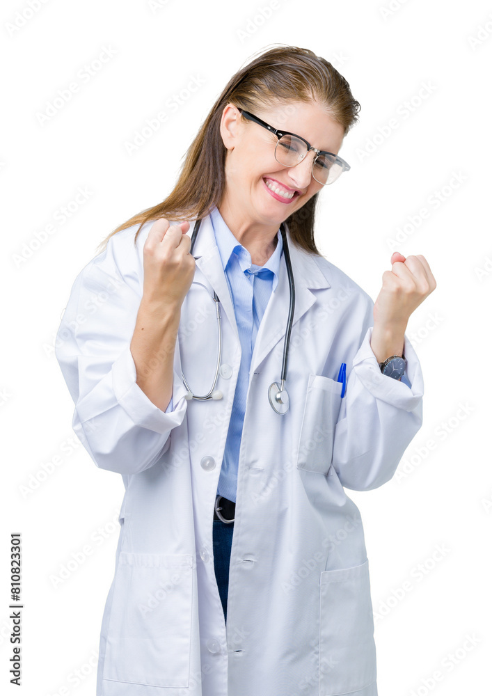 Middle age mature doctor woman wearing medical coat over isolated background very happy and excited doing winner gesture with arms raised, smiling and screaming for success. Celebration concept. Middle age mature doctor woman wearing medical coat over isolated background very happy and excited doing winner gesture with arms raised, smiling and screaming for success. Celebration concept.