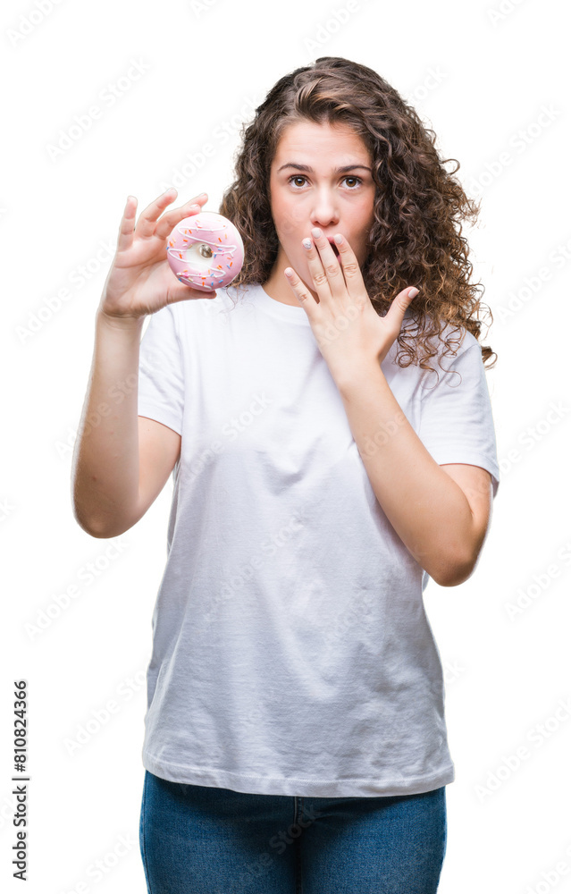 Young brunette girl eating donut over isolated background cover mouth with hand shocked with shame for mistake, expression of fear, scared in silence, secret concept Young brunette girl eating donut over isolated background cover mouth with hand shocked with shame for mistake, expression of fear, scared in silence, secret concept