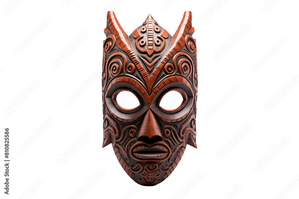 A wooden mask with a horned face and a black eye. The mask is carved from wood and has a tribal design A wooden mask with a horned face and a black eye. The mask is carved from wood and has a tribal design