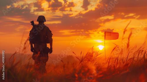  Silhouette soldier salutes American flag at sunrise. Veterans Day tribute. copy space