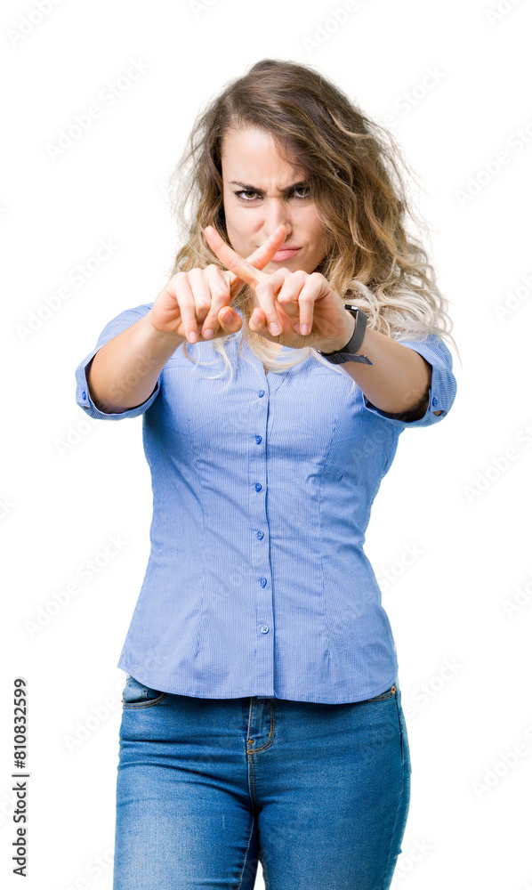 Beautiful young blonde business woman over isolated background Rejection expression crossing fingers doing negative sign Beautiful young blonde business woman over isolated background Rejection expression crossing fingers doing negative sign