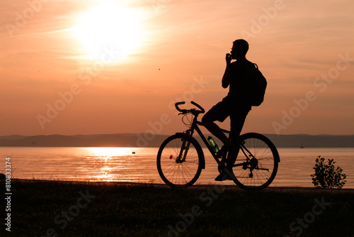 Wallpaper Mural The silhouette of a cyclist at sunset on the lakeshore. Torontodigital.ca