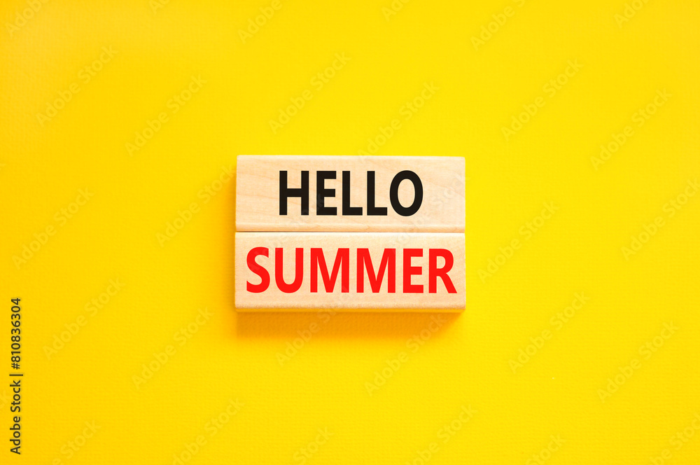 Hello summer symbol. Concept words Hello summer on beautiful wooden block. Beautiful yellow paper background. Business lifestyle Hello summer concept. Copy space. Hello summer symbol. Concept words Hello summer on beautiful wooden block. Beautiful yellow paper background. Business lifestyle Hello summer concept. Copy space.