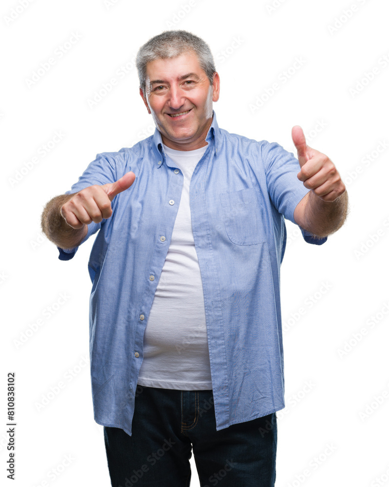 Handsome senior man over isolated background approving doing positive gesture with hand, thumbs up smiling and happy for success. Looking at the camera, winner gesture. Handsome senior man over isolated background approving doing positive gesture with hand, thumbs up smiling and happy for success. Looking at the camera, winner gesture.