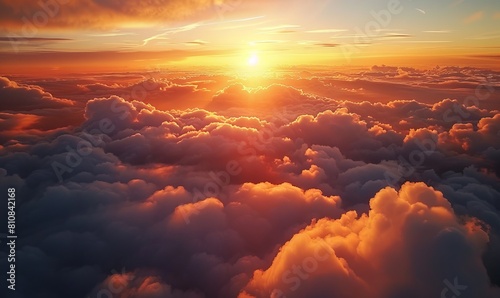 Beautiful aerial view above clouds at sunset. Flying above clouds with sunlight.