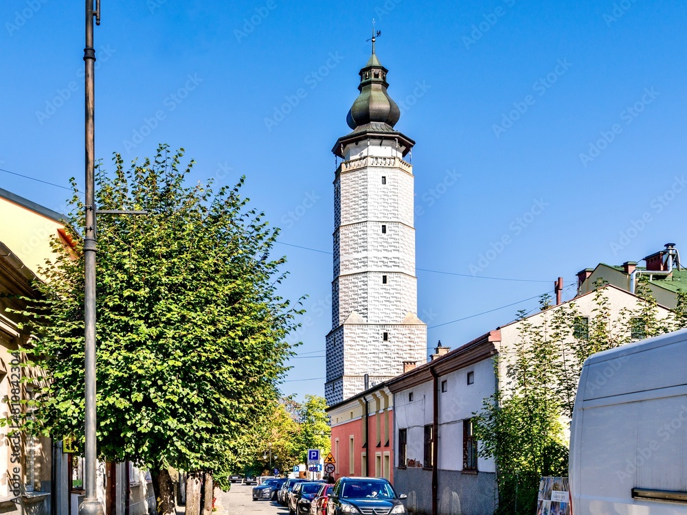 Obraz premium Decorated with geometric patterns, the ancient tower of the town hall, rising above the market square of the Polish city of Biecz in the Lesser Poland Voivodeship.