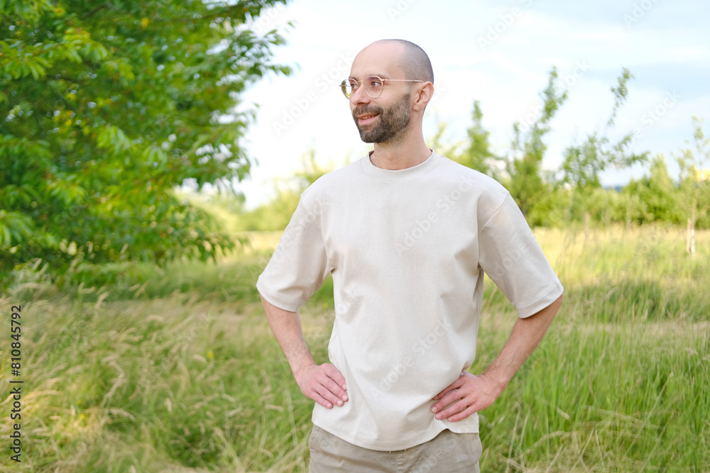 young 30-year-old serious man Outdoors in nature, Subtle Smile on Lips, Psychology and Impact, Seriousness and Determination, Mental Health in Third Decade, Active Lifestyle young 30-year-old serious man Outdoors in nature, Subtle Smile on Lips, Psychology and Impact, Seriousness and Determination, Mental Health in Third Decade, Active Lifestyle