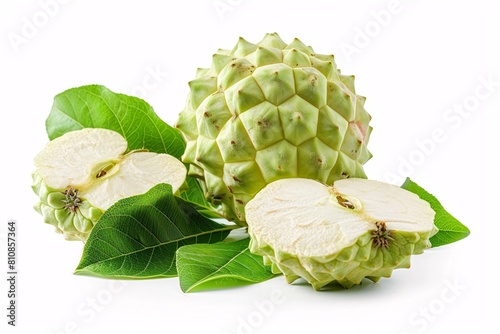 Freshly harvested Custard Apples with sliced pieces and leafy greens on a white backdrop. photo