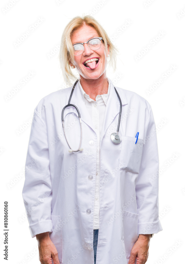 Middle age blonde doctor woman over isolated background sticking tongue out happy with funny expression. Emotion concept. Middle age blonde doctor woman over isolated background sticking tongue out happy with funny expression. Emotion concept.