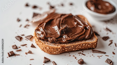 A close up of a piece of bread with chocolate spread on it. AIG51A. photo