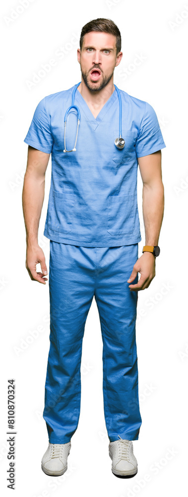 Handsome doctor man wearing medical uniform over isolated background In shock face, looking skeptical and sarcastic, surprised with open mouth Handsome doctor man wearing medical uniform over isolated background In shock face, looking skeptical and sarcastic, surprised with open mouth