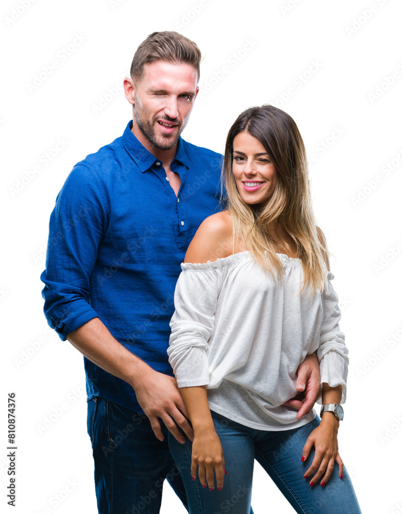 Young couple in love over isolated background winking looking at the camera with sexy expression, cheerful and happy face. Young couple in love over isolated background winking looking at the camera with sexy expression, cheerful and happy face.