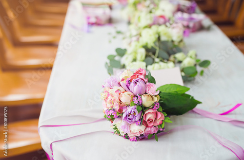 Wedding bouquet on table. Pink roses, tulips and forget-me-nots