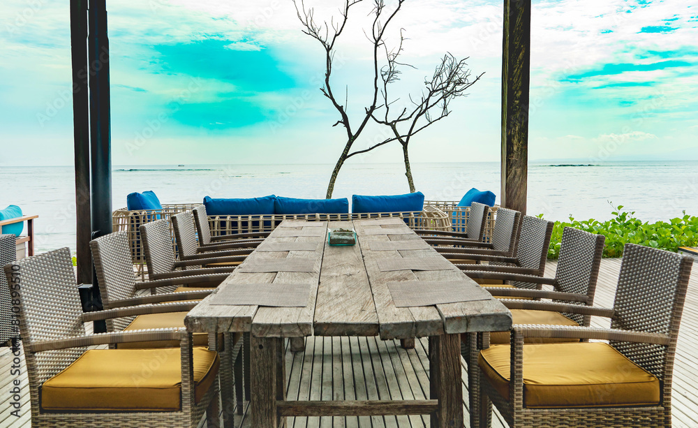 Fototapeta premium table and chairs on the beach, sanur bali