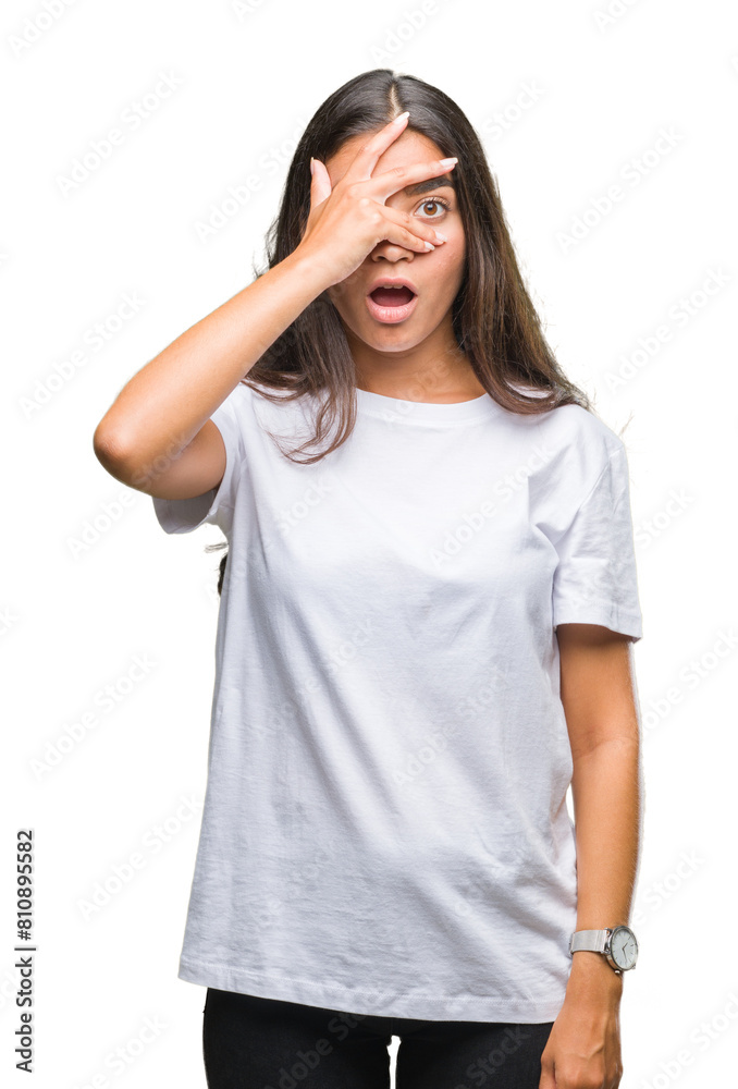 Young beautiful arab woman over isolated background peeking in shock covering face and eyes with hand, looking through fingers with embarrassed expression. Young beautiful arab woman over isolated background peeking in shock covering face and eyes with hand, looking through fingers with embarrassed expression.