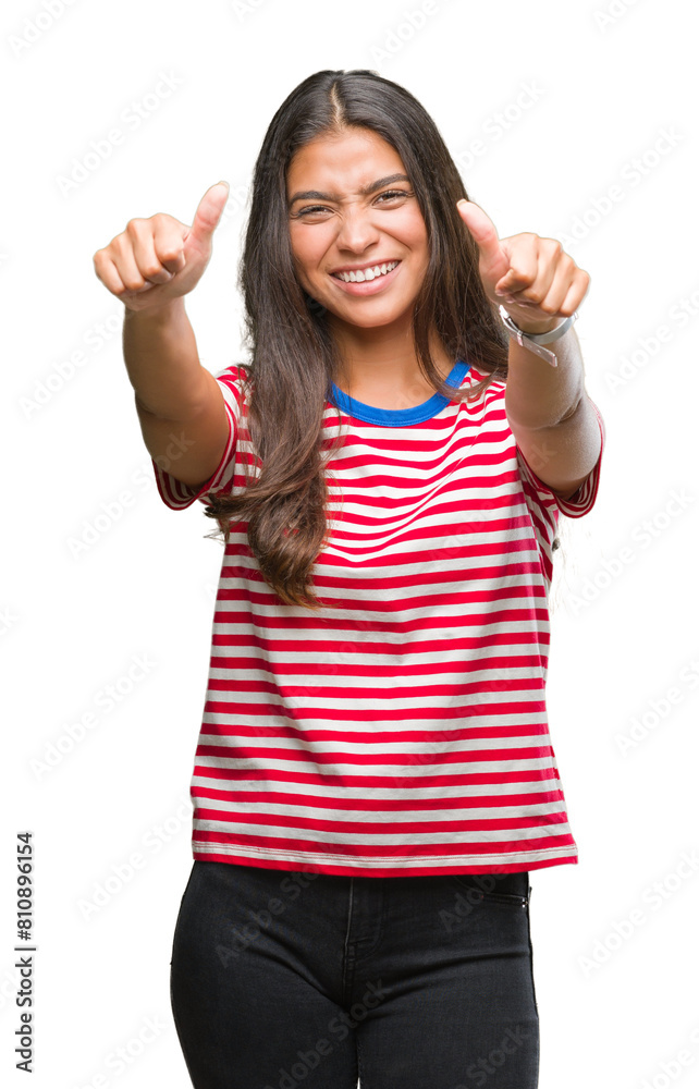 Young beautiful arab woman over isolated background approving doing positive gesture with hand, thumbs up smiling and happy for success. Looking at the camera, winner gesture. Young beautiful arab woman over isolated background approving doing positive gesture with hand, thumbs up smiling and happy for success. Looking at the camera, winner gesture.
