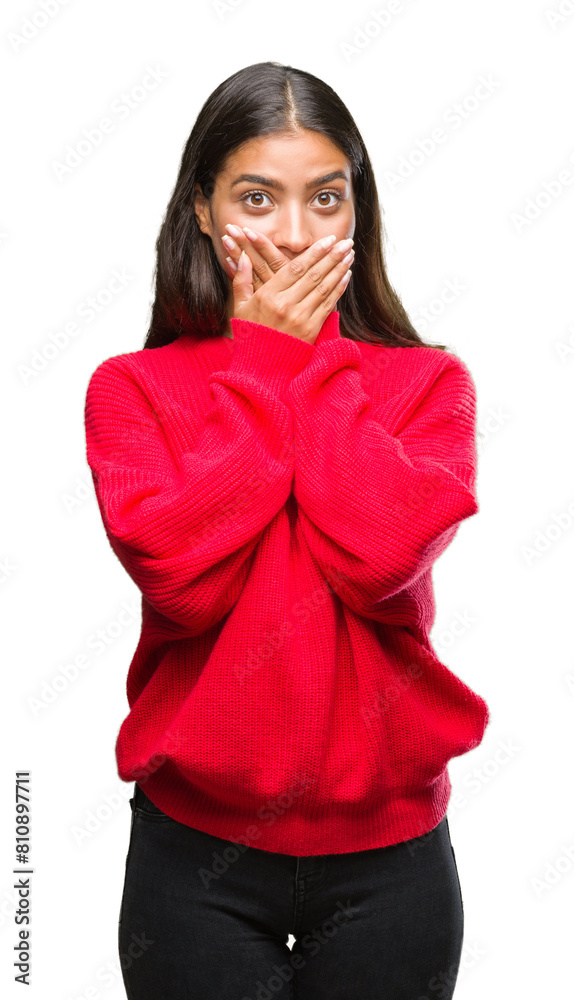 Young beautiful arab woman wearing winter sweater over isolated background shocked covering mouth with hands for mistake. Secret concept.