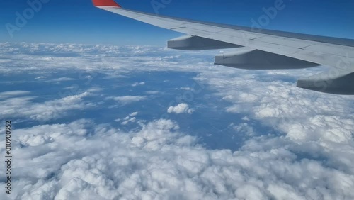 Aerial view of clouds, blue sunny sky, bird's-eye view.