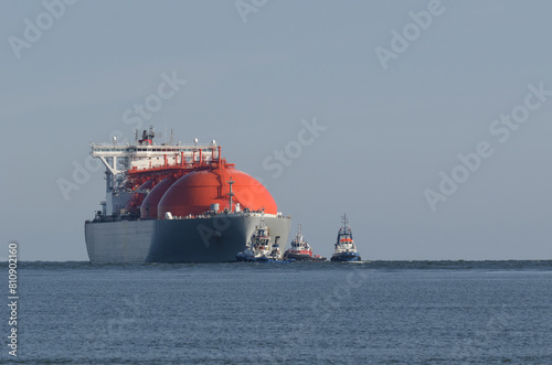 LNG TANKER - Ship assisted by tugboats sails to the gas terminal

 photo