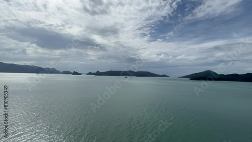 Malaysia, Langkawi, panoramic view of the Straits of Malacca and several islands, Pulau Singa Besar, Basah, Pulo Singha Kintut and its lush green coastline as seen from a cruise ship photo