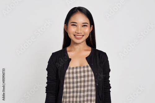 Canvastavla Portrait of a smiling beautiful Asian woman wearing casual shirt looking at camera with smile toothy isolated on white background