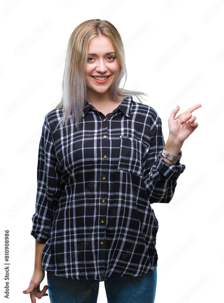 Young blonde woman over isolated background with a big smile on face, pointing with hand and finger to the side looking at the camera. Young blonde woman over isolated background with a big smile on face, pointing with hand and finger to the side looking at the camera.