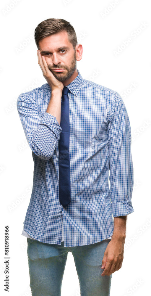 Young handsome business man over isolated background thinking looking tired and bored with depression problems with crossed arms.