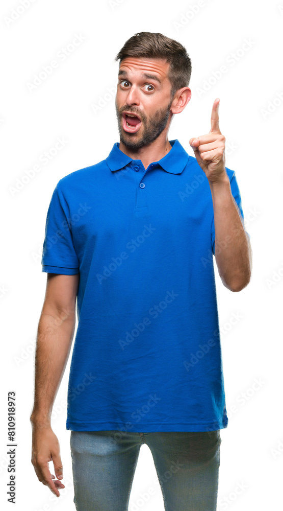 Young handsome man over isolated background pointing finger up with successful idea. Exited and happy. Number one. Young handsome man over isolated background pointing finger up with successful idea. Exited and happy. Number one.