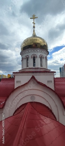 View of an Orthodox church through a rain-soaked window