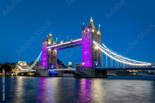 The Tower Bridge and the river Thames at night in London, UK