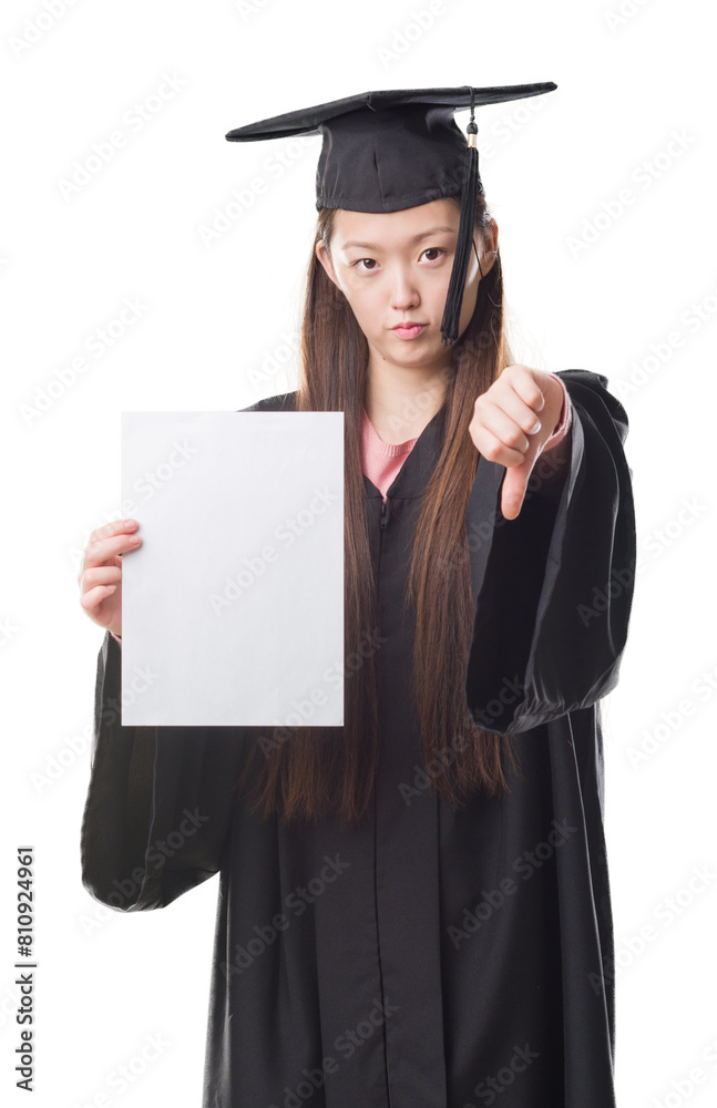 Young Chinese woman wearing graduate uniform holding paper degree with angry face, negative sign showing dislike with thumbs down, rejection concept Young Chinese woman wearing graduate uniform holding paper degree with angry face, negative sign showing dislike with thumbs down, rejection concept